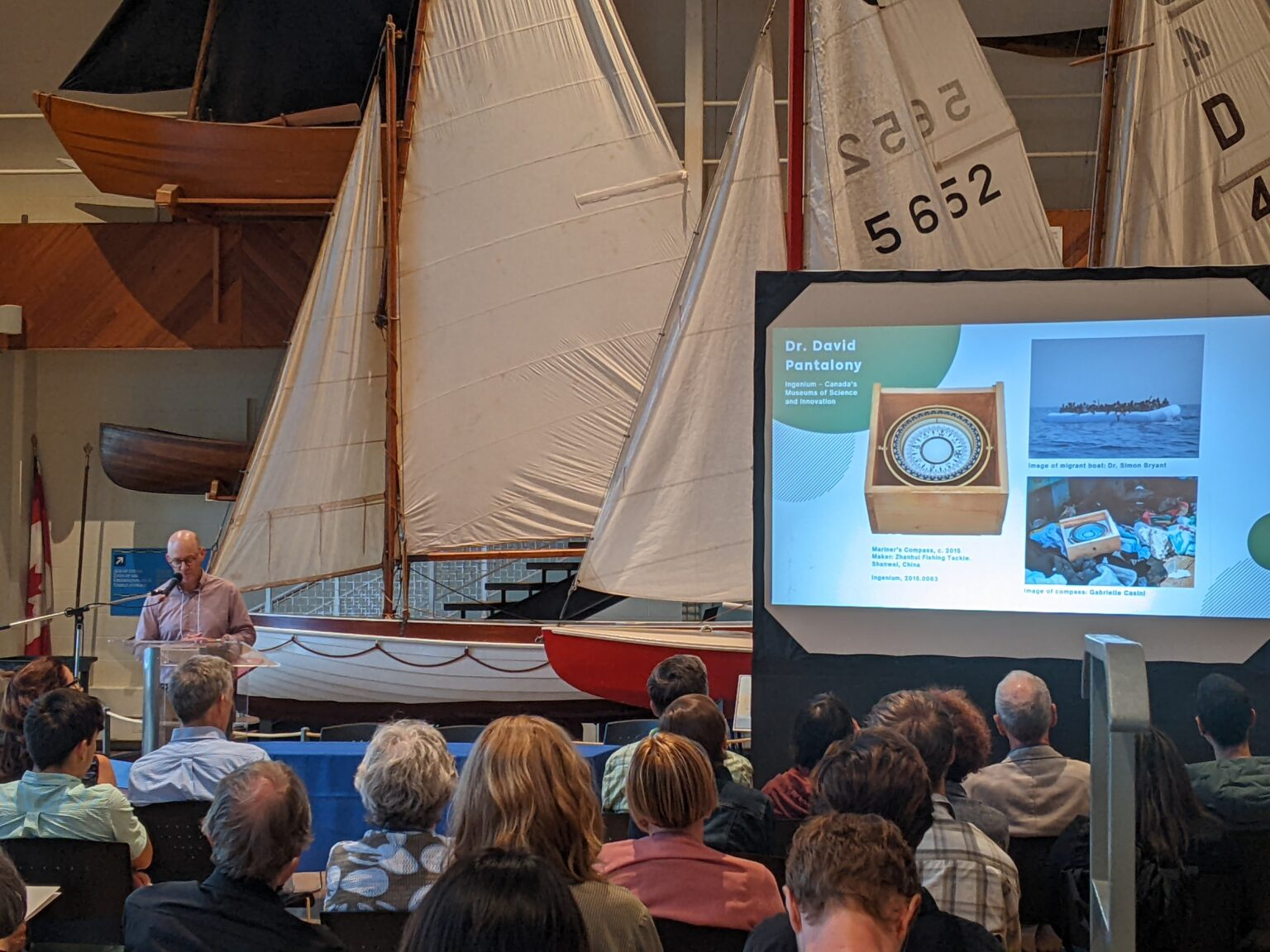 David Pantolony at a podium with slide presentation